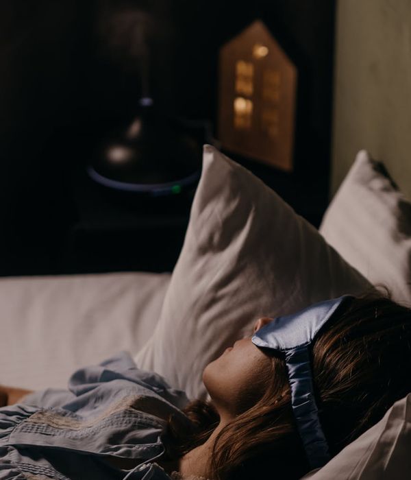 Young woman resting her eyes in a peaceful room environment